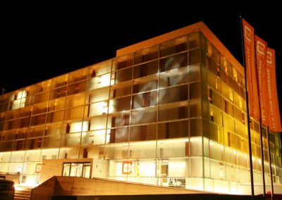 cube hotel orange illumiated facade night all-in-one sport